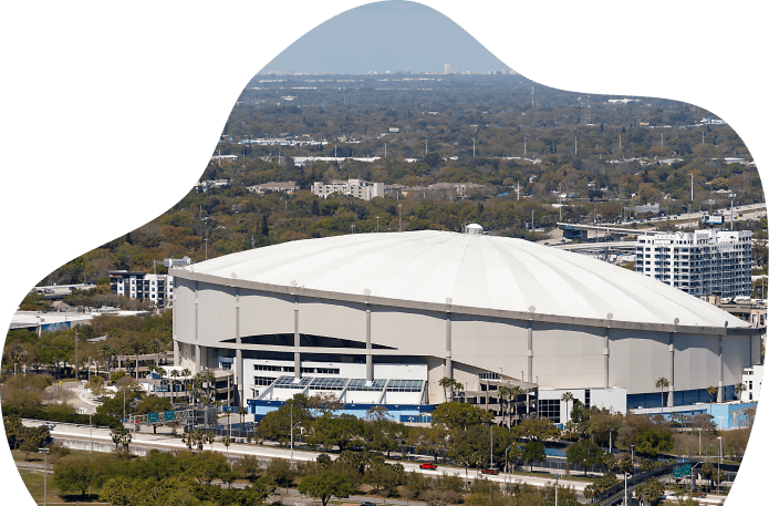 Aerial view of large domed stadium.