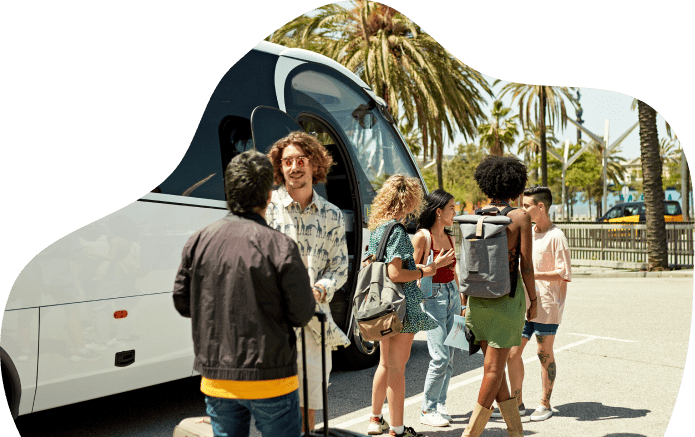 People gathered near a parked tour bus.