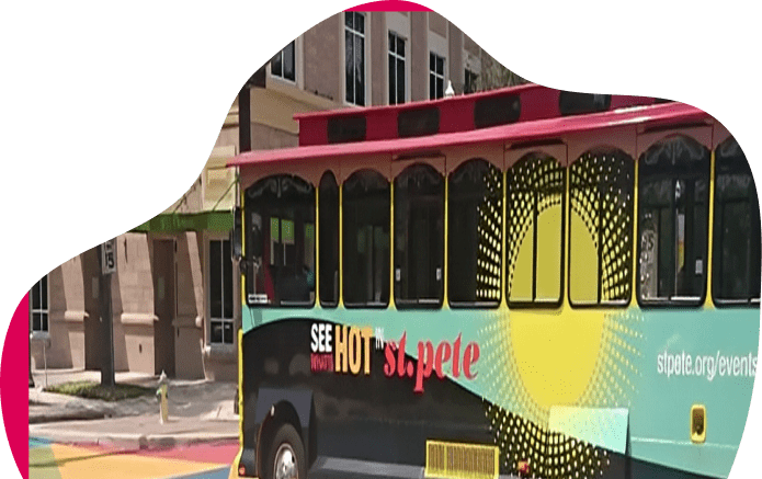 Colorful trolley with "See Hot St. Pete" signage.